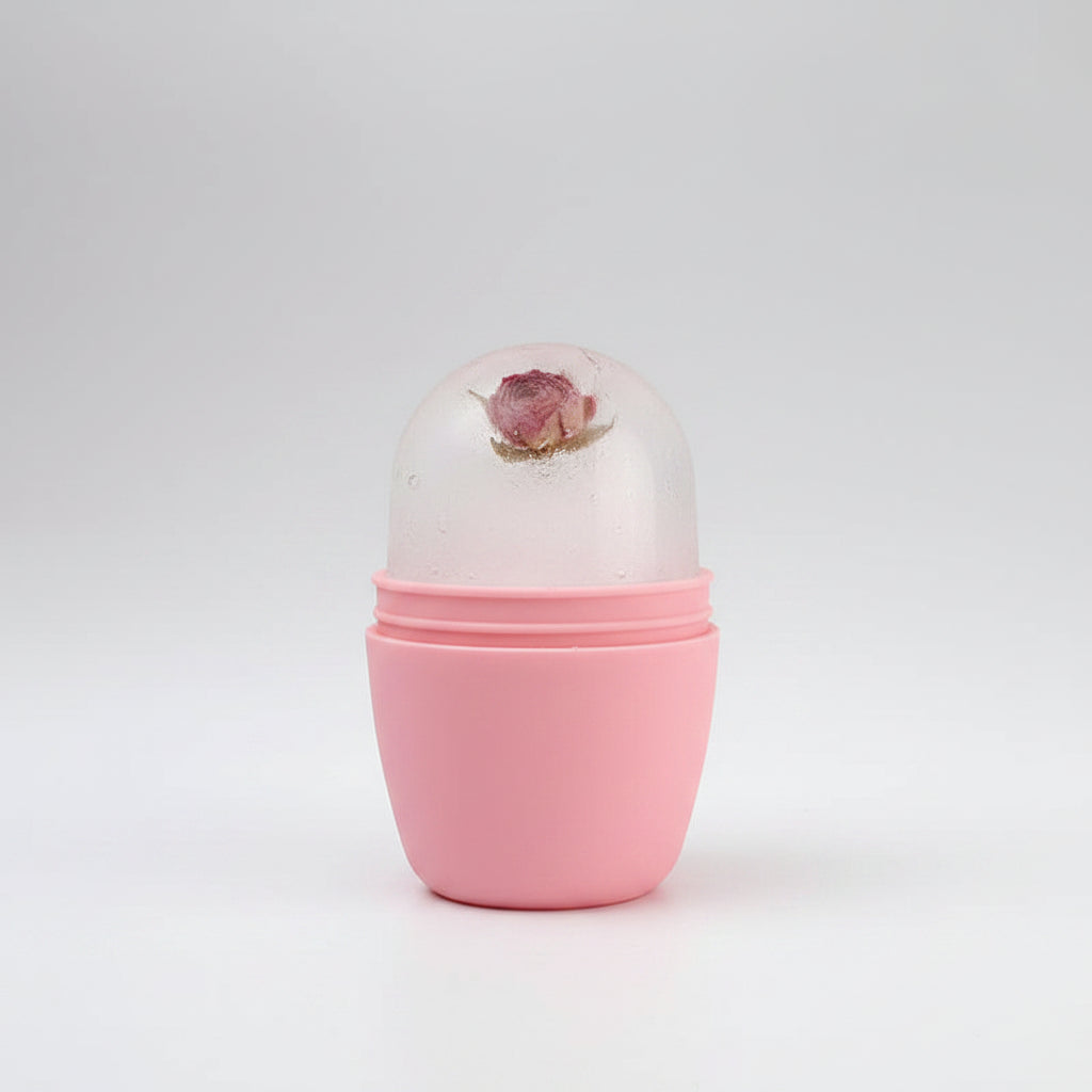 Hand holding a pink cylindrical container with a floral design on a white background